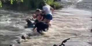WATCH: Bystanders save woman trapped under flooded southern Arizona bridge