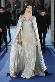 Alexis Mabille presents a reversible couture collection at Paris Fashion Week, showcasing dual personalities and AI integration.