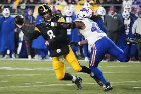 Rodgers Bloodied but Unshaken in Wild Steelers–Bills Clash