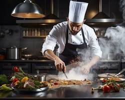professional chef preparing a dish in a commercial kitchen resmi