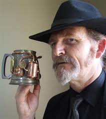 Iain Clark holds a steam-powered beer tankard on display in a steampunk exhibition at the Forrester Gallery. Photo by Sally Rae. - iain_clark_holds_a_steam_powered_beer_tankard_on_d_8734245444