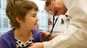 A doctor at the Children&#39;s Hospital of Philadelphia examines Emma Whitehead. (File photo) - hbeig20121212033341710