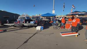 Denver fans rally at Empower Field tailgate ahead of Broncos playoff game against the Bills