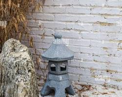Hình ảnh về natural stone incense burner in a garden