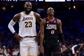 James hits go-ahead 3 and scores 29 points, Doncic has triple-double in Lakers’ win over 76ers