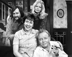 All in the Family 1971 TV series cast Carroll O'Connor as Archie Bunker Jean Stapleton as Edith Rob Reiner Sally Struthers 1970s CBS television stills living room chair, AI generated