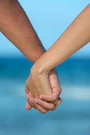 Two people holding hands