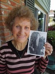 Lucy Leon with a photo taken of her husband, Frederick Martin Leon, in 1943 when he played football for Point Loma High School before he interrupted his ... - B6E7_DSCN1411