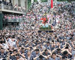 Gion Yamakasa festival in Iki Island, with a large crowd watching the procession.の画像