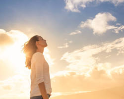 Image of person looking towards a bright future