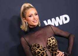 Paris Hilton Dazzles in Sheer Bejeweled Mesh Dress for Rare Red Carpet Appearance With Lookalike Kids