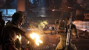 A screenshot from the official launch trailer of Aliens: Fireteam Elite 2 showing characters in combat gear facing alien creatures.
