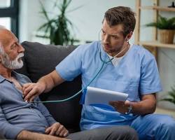 Image of doctor and patient listening to a heartbeat with a stethoscope