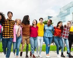 Image of photo of a diverse group of people interacting in a public space