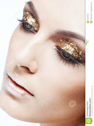 Close-up shot of female face with vogue golden shining eye makeup. MR: YES; PR: NO - golden-eye-makeup-close-up-shot-female-face-vogue-shining-34724528