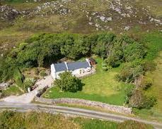 Image of small, charming cottage nestled on the Highland estate, serving as a guest house