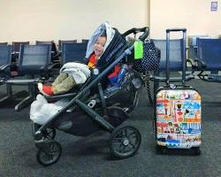 stroller and luggage at an airportの画像