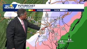 Snowfall sticking north and west of city, where temps below freezing