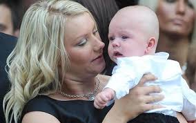 Joanne McAleese holds five-month-old son Charley during the funeral of her husband Sgt Paul McAleese Photo: PA - funeral2_1481451c