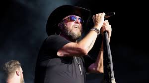 Country music singer 'pulled through a windshield' in tour bus crash