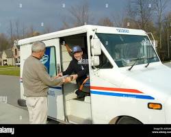 Image of mail carrier driving a truck across the country