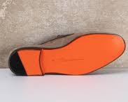 Santoni's iconic orange leather soleの画像