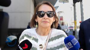 Accused killer cop’s mother charged with perverting justice