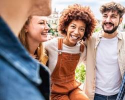 Image of group of friends laughing and celebrating together