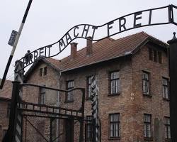 Image of group of Holocaust survivors gather at the AuschwitzBirkenau concentration camp memorial site, 2019
