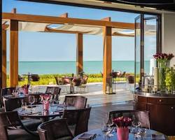 stylish restaurant interior with a view of a resort settingの画像