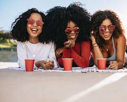 Image of group of friends laughing and having fun at a bar in New York City