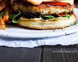 Image of Salmon Burgers with Avocado Crema and Sweet Potato Fries