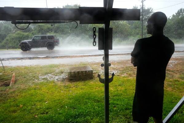 Tropical Depression Edouard drenches Texas with flash flooding and downed trees as it moves north; about 30,000 customers without power