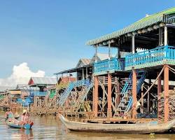 Image of Tourists on a boat tour exploring a floating village in Cambodia