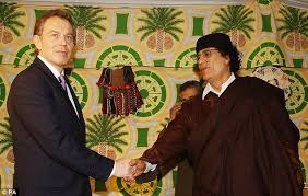 Image result for hillary clinton with gaddafi son