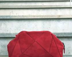 Image of origami pouch crafted from soft red leather