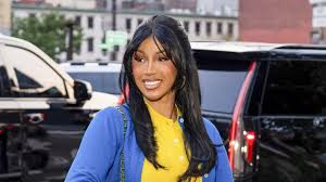 Cardi B trades her plunging necklines for a surprisingly preppy look featuring capri pants