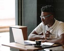 Image of person working on a laptop at a coffee shop