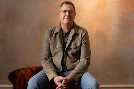 Vince Gill with acoustic guitar