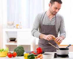 person preparing a healthy meal in their kitchen