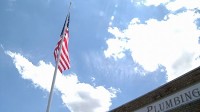 Giant display of patriotism flies high over woman-owned CNY heating, plumbing company