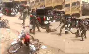 Image result for soldiers molested a physically challenged person for wearing a camouflage