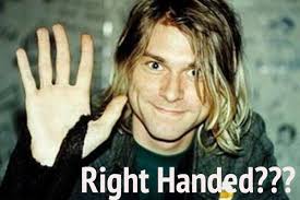 Quick fact: Kurt Cobain famously played the guitar left-handed but he was in fact actually right-handed. Kurt Cobain RIght Handed - Kurt_Cobain_waving_right_hand_handed_nirvana
