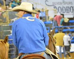 Image of family enjoying the rodeo