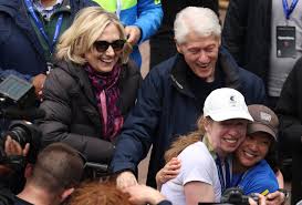 Chelsea Clinton greeted by famous parents after finishing Marathon