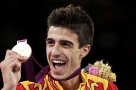 Gold medallist Spain&#39;s Joel Gonzalez Bonilla bites his medal at the men&#39;s -58kg taekwondo victory ceremony during the London 2012 Olympic Games at the ExCeL ... - M_Id_307568_Joel_Gonzalez_Bonilla