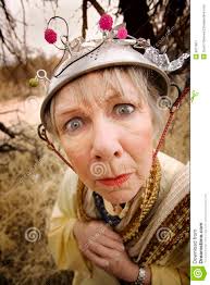 Crazy woman wearing a metal colander for a helmet. MR: YES; PR: NO - crazy-woman-8871851