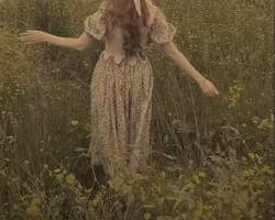 Imagen de person in a floral dress walking through a meadow, in Cottagecore style