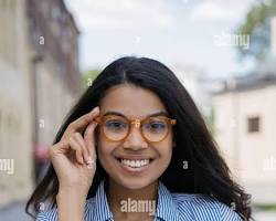 Image of someone wearing stylish glasses and looking confident