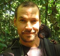 Split second: Hendrik Coetzee, 35, was leading a three-man expedition on the Lakuga River, Congo, when he was grabbed by a crocodile and pull underwater - article-1340547-0C6AA38B000005DC-935_634x593